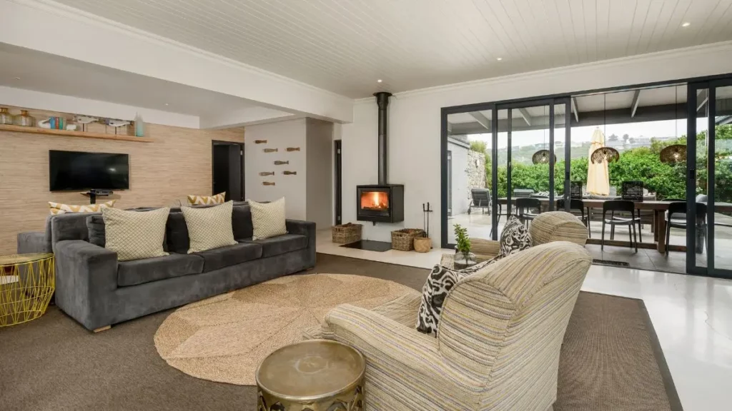 a neutral coloured living room with a fireplace