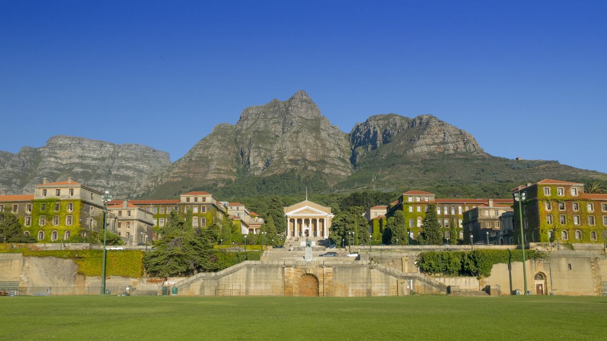 university buildings against the mountain backdrop