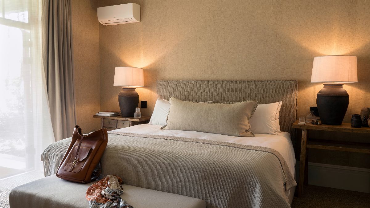 a king size bed in a room with muted colours