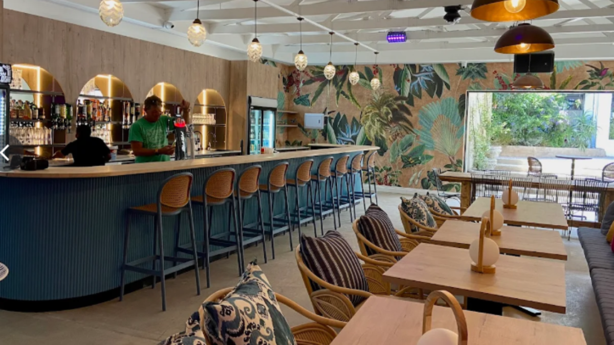 people working behind a bar in a restaurant