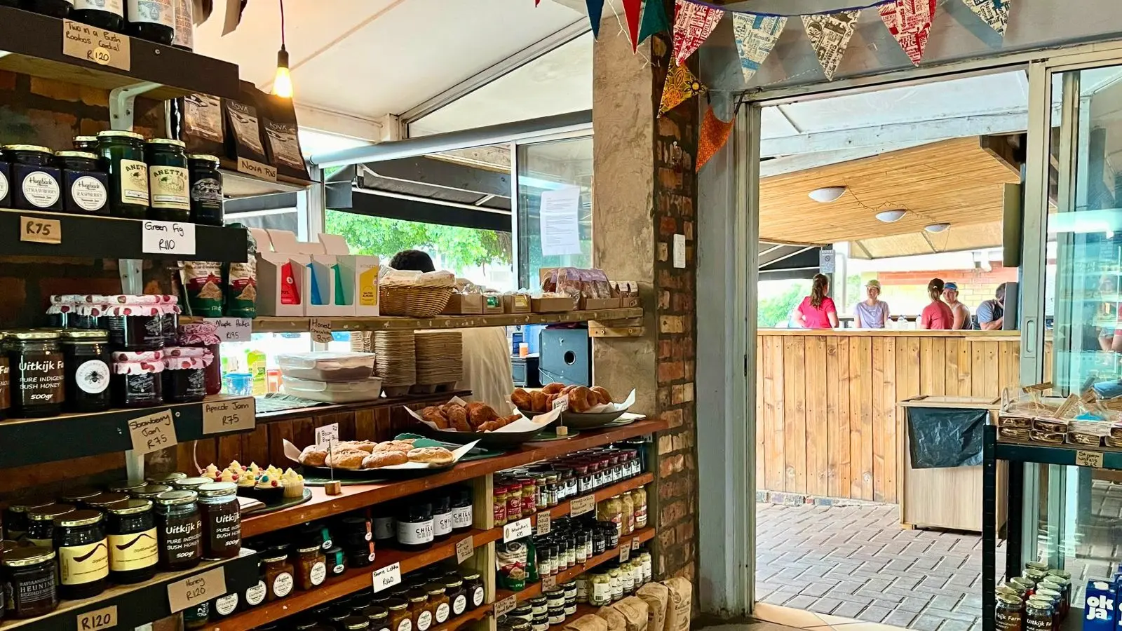 a bakery with shelves of baked goods and condiments