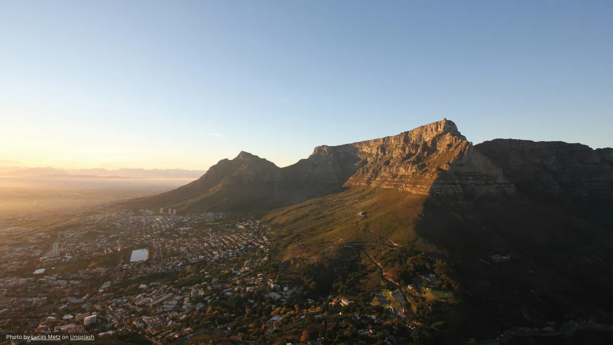 a view of table mountain and the city at dawn