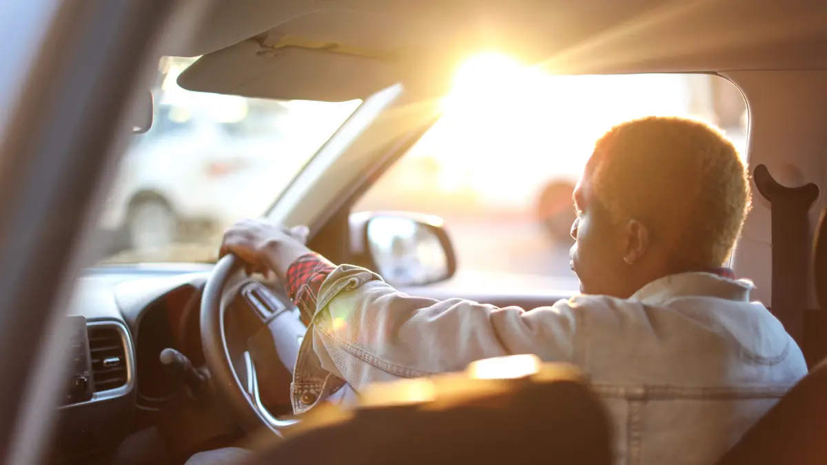 close up of a man driving a car
