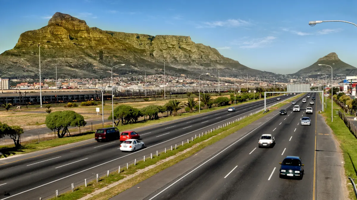 double highway in cape town with table mountain in the background