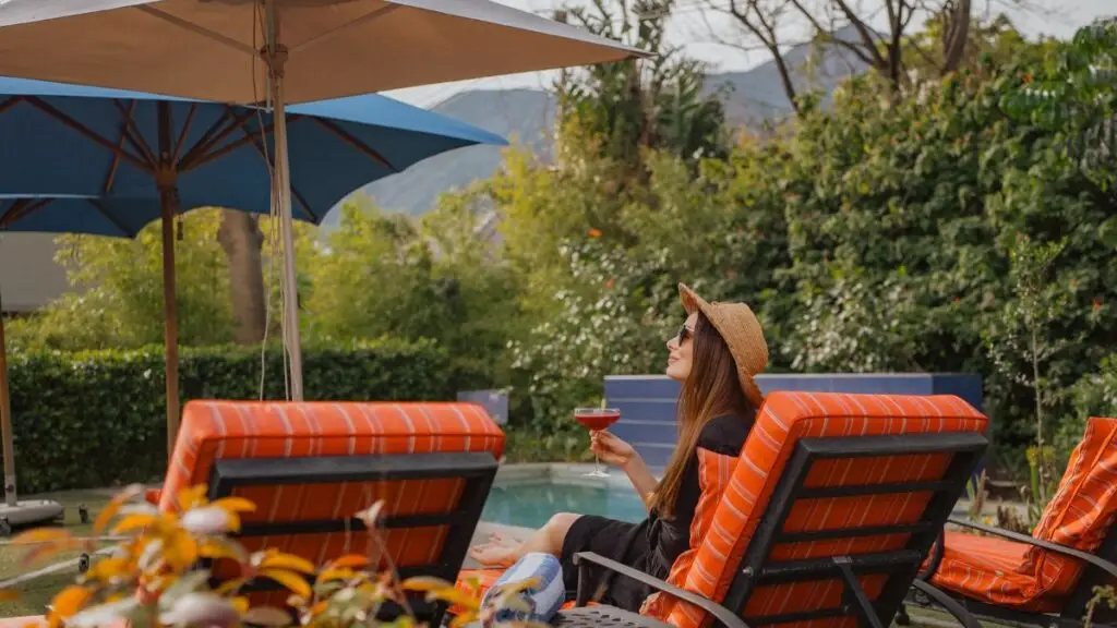 guest relaxing at the La Fontaine pool
